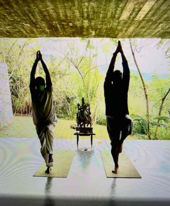 two people doing yoga